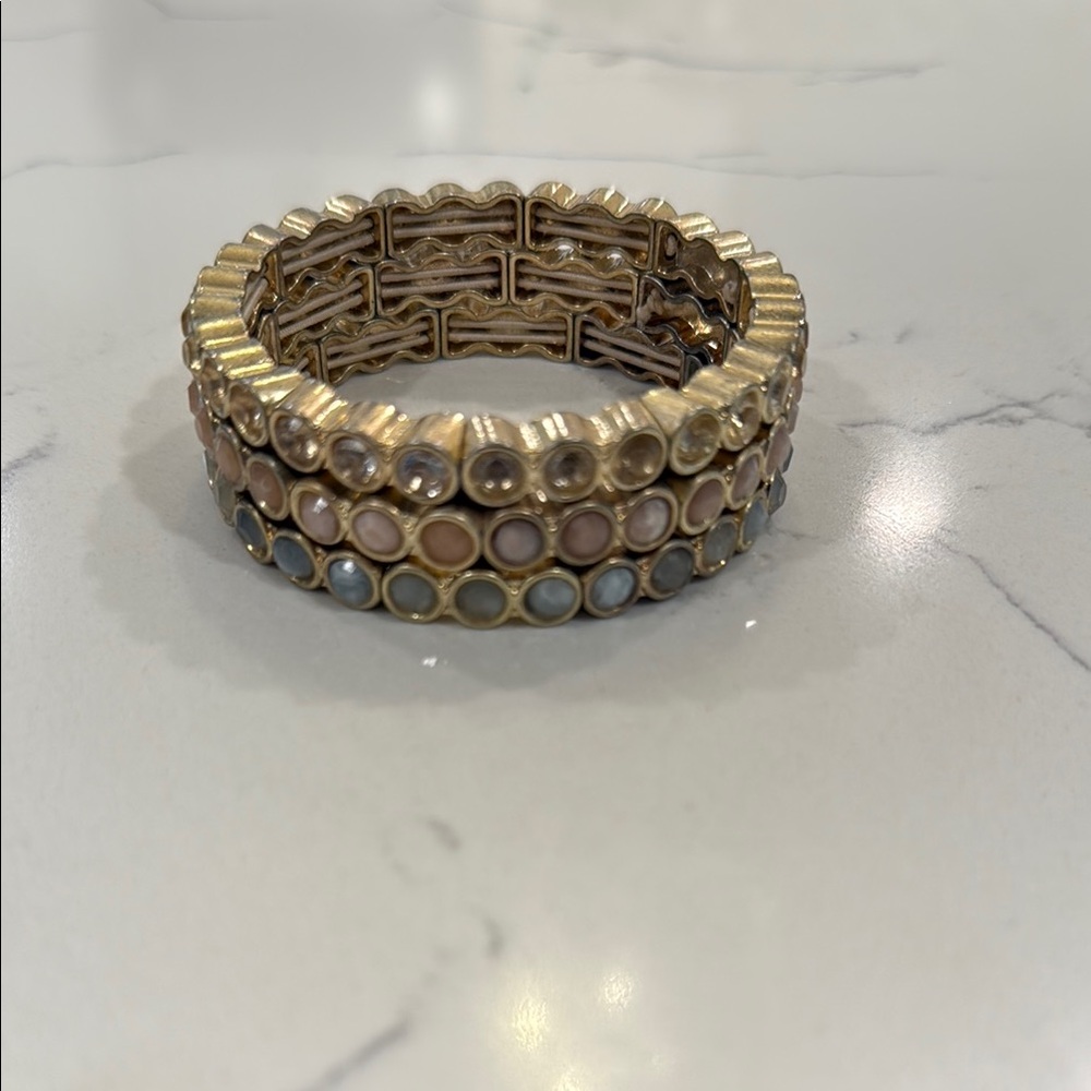 LOFT gold and pastel stack of stretch bracelets